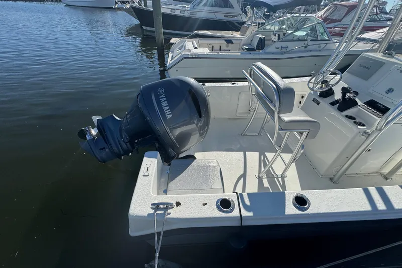 Slide: The Image of 2019 KenCraft 21 boat with Yamaha outboard motor docked at marina. - 4