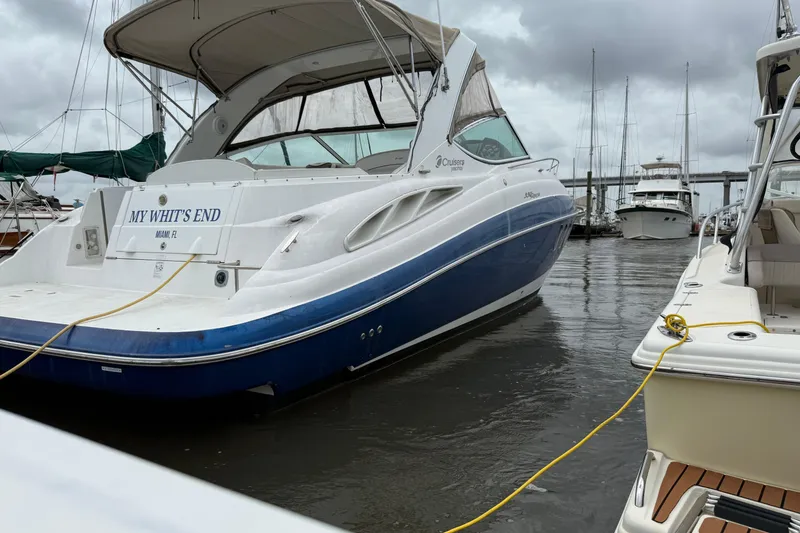 Slide: The Image of 2008 Cruisers Yachts 330 Express docked in marina, overcast sky. - 1