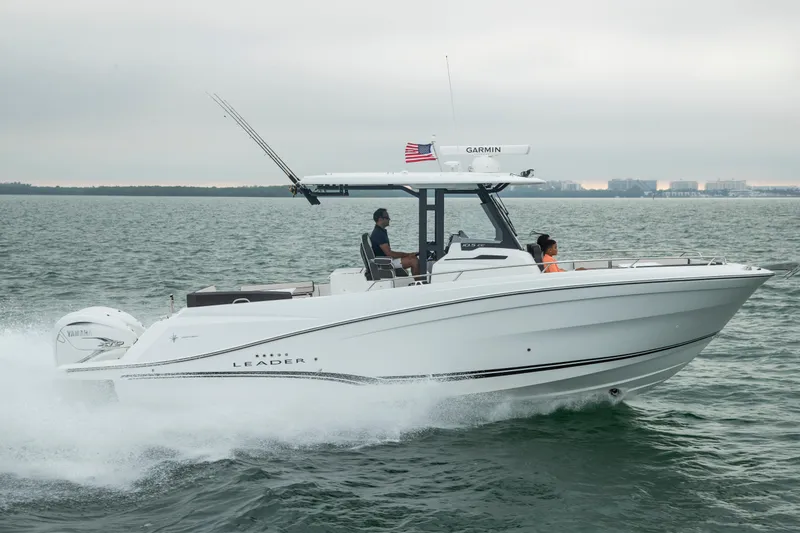 The Image of 2024 Jeanneau Leader 10.5CC cruising on open water, side view. - 1