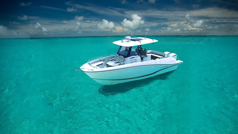 Slide: The Image of 2024 Jeanneau Leader 10.5CC boat on clear turquoise water under a blue sky. - 7