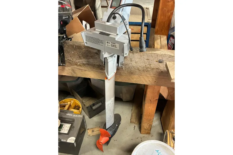 Slide: The Image of 2018 Torqeedo Travel 1003 S electric outboard motor in a workshop setting. - 1