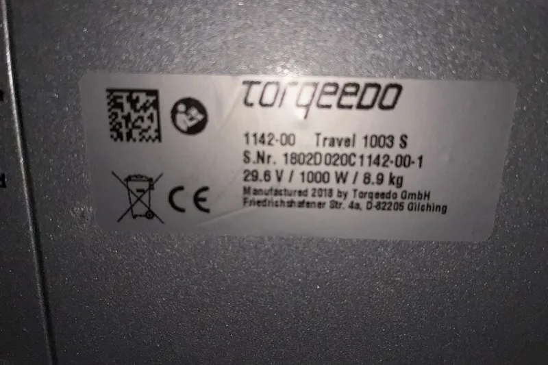 Slide: The Image of Label on 2018 Torqeedo Travel 1003 S, showing specifications and manufacturing details. - 3