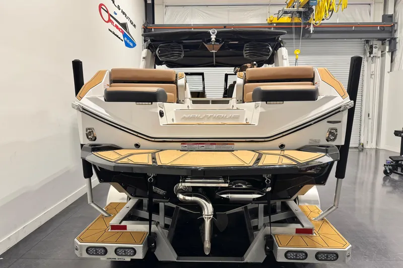 Slide: The Image of 2024 Nautique Super Air Nautique G23 Paragon boat, rear view in showroom. - 4