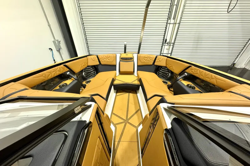 Slide: The Image of 2024 Nautique Super Air Nautique G23 Paragon interior with luxurious tan seating and modern design. - 8