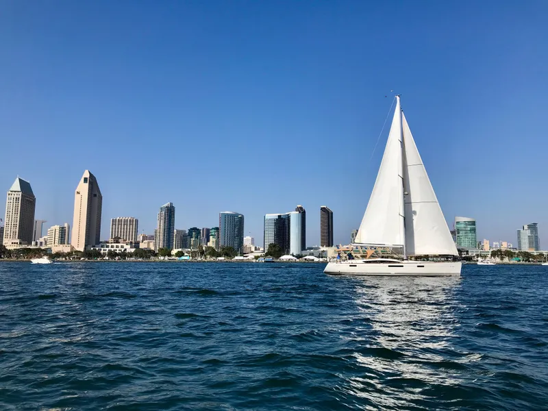 Slide: The Image of Sailboat Jeanneau 57 (2014) on water with city skyline in background. - 3
