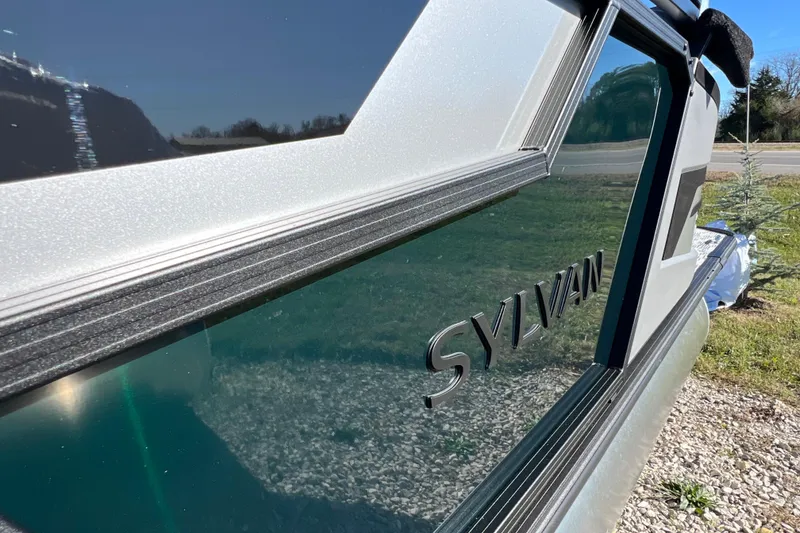 Slide: The Image of 2026 Sylvan R22 CLZ DH boat exterior with sleek design and reflective surface. - 5