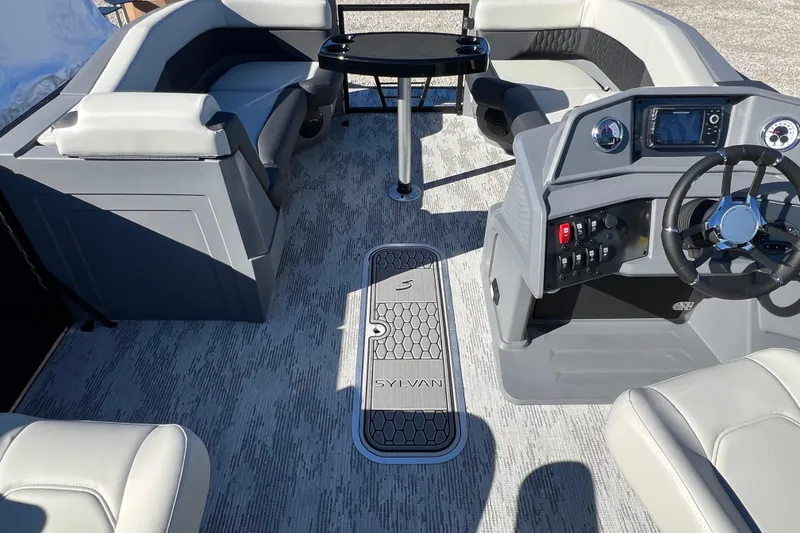 Slide: The Image of 2026 Sylvan R22 CLZ DH boat interior with modern seating and control panel. - 7