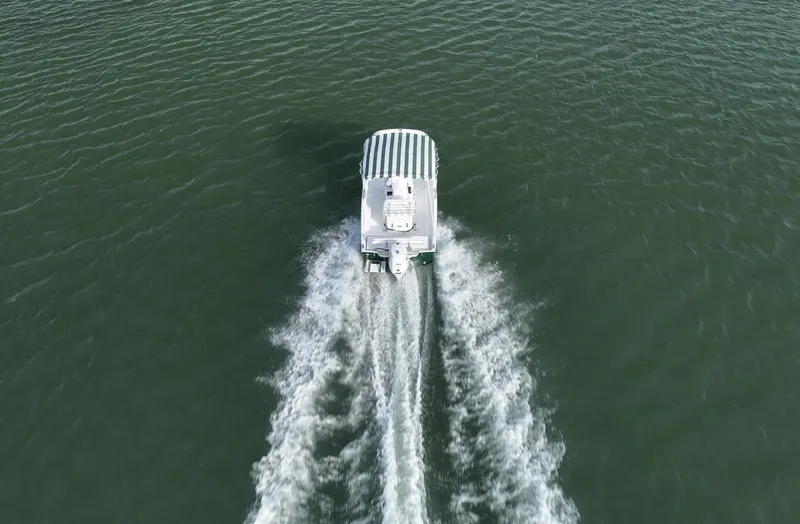 Slide: The Image of Aerial view of 2026 Palm Yachts 17 cruising on open water. - 5
