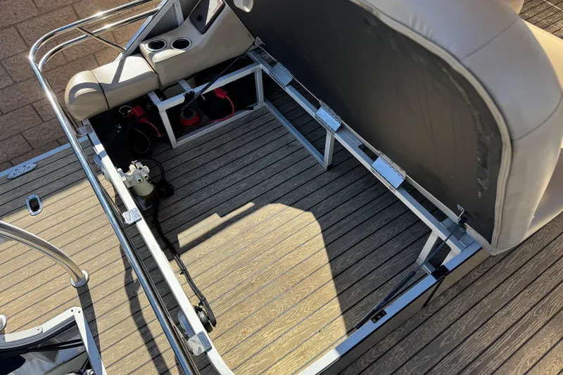 Slide: The Image of 2022 Silver Wave 2410 SW5 JS boat interior with open storage compartment and seating. - 18