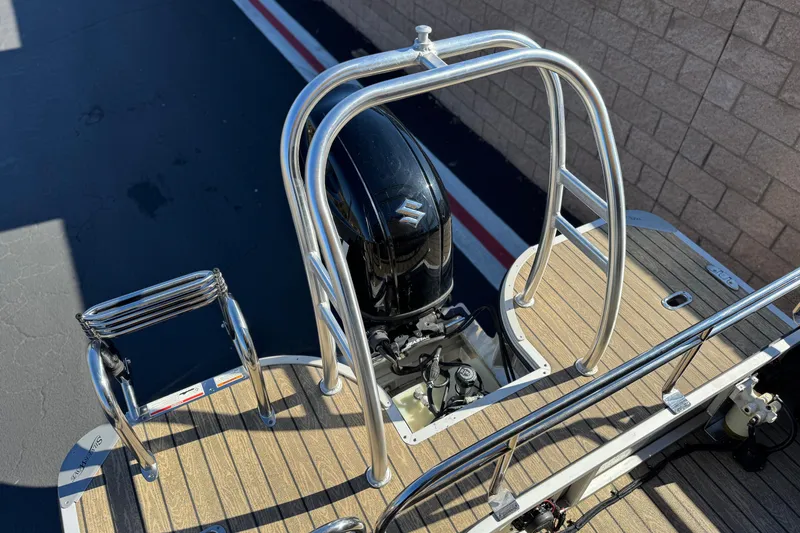 Slide: The Image of 2022 Silver Wave 2410 SW5 JS boat with Suzuki outboard motor and stainless steel railings. - 19