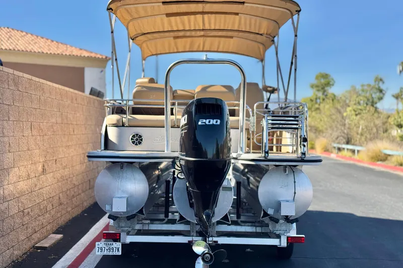 Slide: The Image of 2022 Silver Wave 2410 SW5 JS pontoon boat with Suzuki 200 engine on trailer. - 5