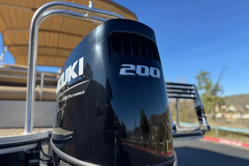 Slide: The Image of 2022 Silver Wave 2410 SW5 JS with Suzuki 200 outboard motor, sunny day. - 8