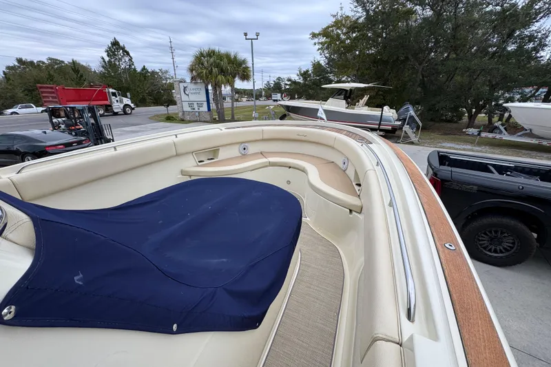 Slide: The Image of 2020 Chris-Craft Catalina 30 boat with covered seating area, parked outdoors. - 18