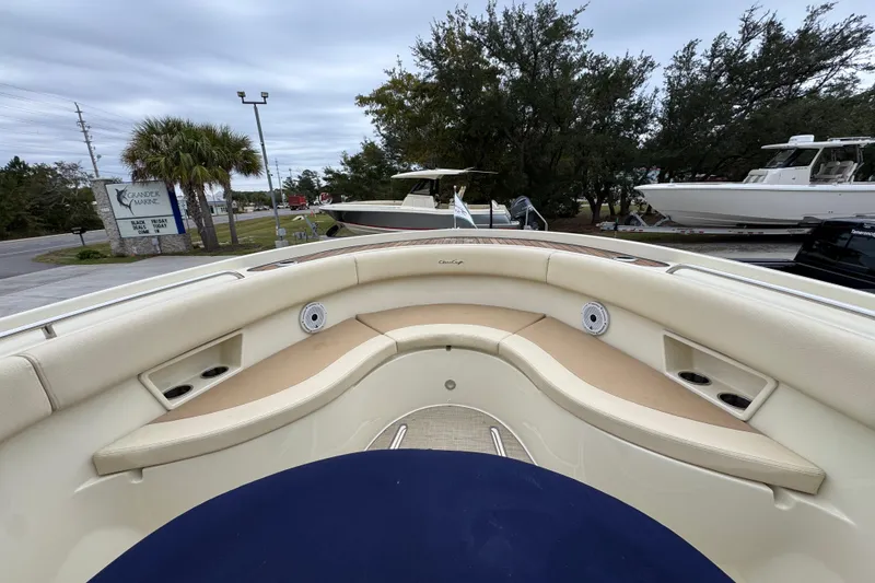 Slide: The Image of 2020 Chris-Craft Catalina 30 boat interior with beige seating and cup holders. - 19