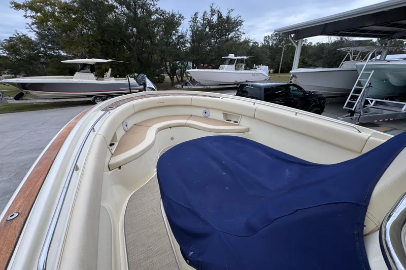 Slide: The Image of 2020 Chris-Craft Catalina 30 boat with covered seating area, parked outdoors. - 20