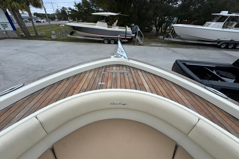 Slide: The Image of 2020 Chris-Craft Catalina 30 boat with teak deck and cushioned seating. - 21