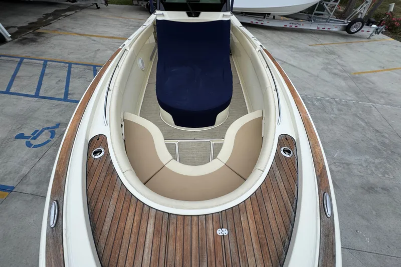 Slide: The Image of 2020 Chris-Craft Catalina 30 boat with elegant wood deck and spacious seating. - 22