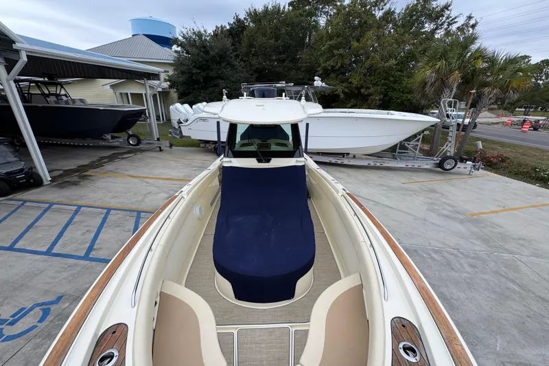 Slide: The Image of 2020 Chris-Craft Catalina 30 boat on display at a marina with other boats. - 23