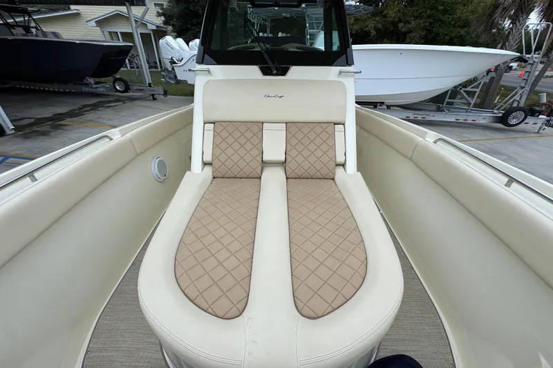Slide: The Image of 2020 Chris-Craft Catalina 30 boat interior with beige quilted seating. - 25