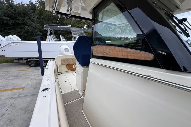 Slide: The Image of 2020 Chris-Craft Catalina 30 boat, docked with sleek design and luxurious features. - 27