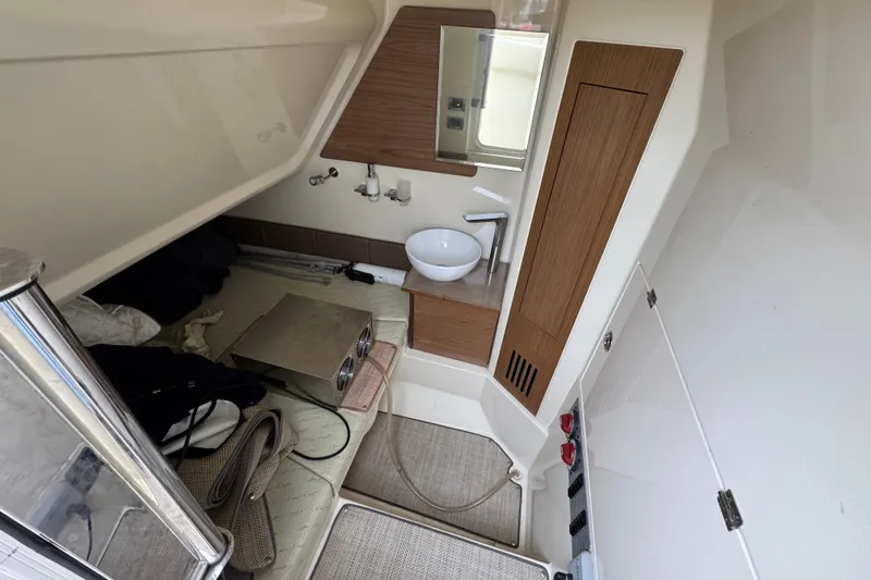 Slide: The Image of 2020 Chris-Craft Catalina 30 interior cabin with sink and storage. - 28