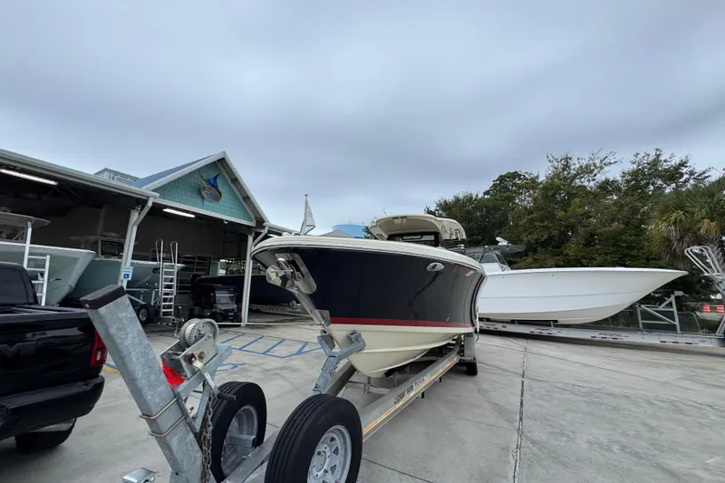 Slide: The Image of 2020 Chris-Craft Catalina 30 boat on trailer at marina, overcast sky. - 5