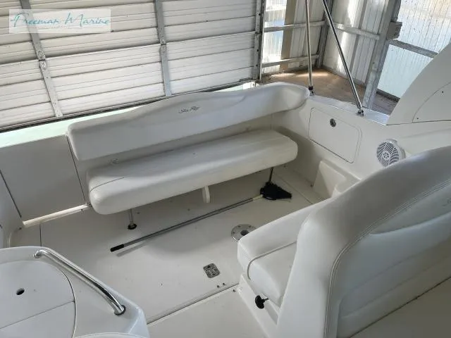 Slide: The Image of 2007 Sea Ray 280 Sundancer interior with white seating and spacious layout. - 12