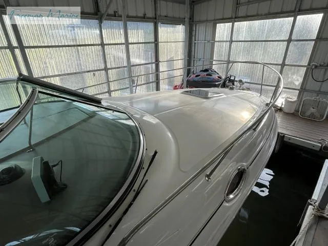 Slide: The Image of 2007 Sea Ray 280 Sundancer docked in a covered marina. - 17