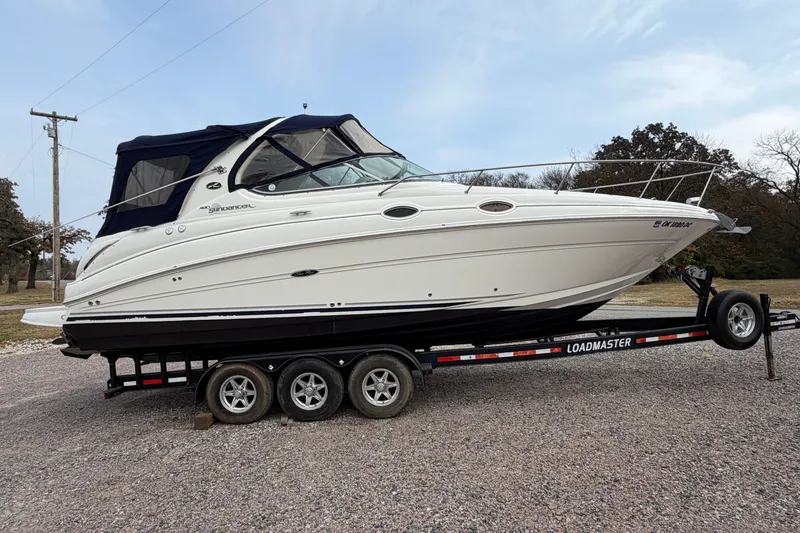Slide: The Image of 2007 Sea Ray 280 Sundancer boat on trailer, parked outdoors. - 20
