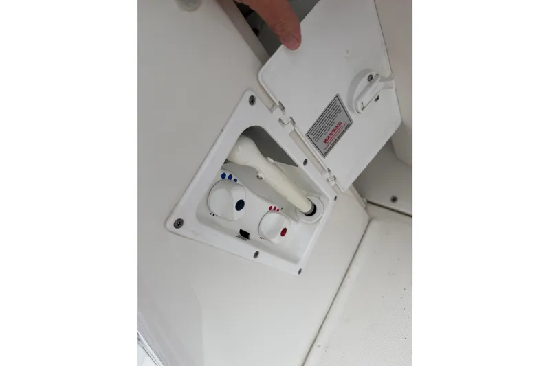 Slide: The Image of 2007 Sea Ray 280 Sundancer water control panel with hot and cold settings. - 24