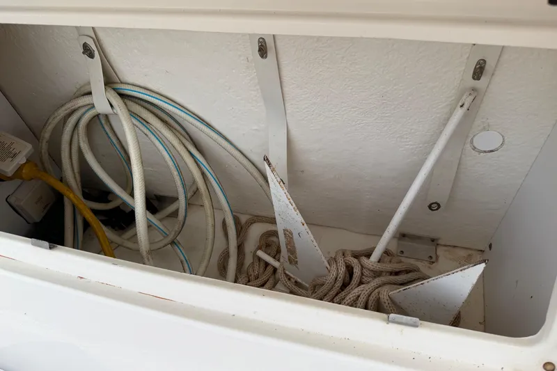 Slide: The Image of Storage compartment with ropes and anchor on 2007 Sea Ray 280 Sundancer boat. - 25