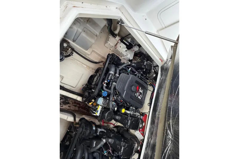 Slide: The Image of Engine compartment of a 2007 Sea Ray 280 Sundancer boat, showcasing mechanical components. - 28