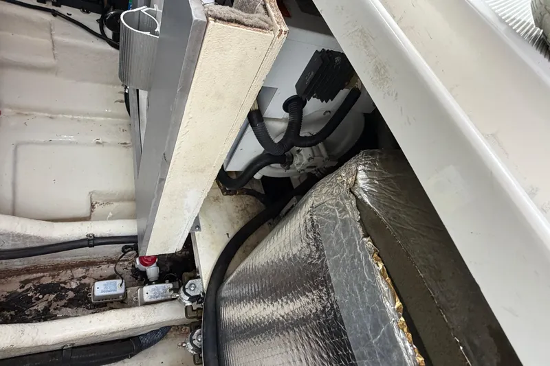 Slide: The Image of Engine compartment of a 2007 Sea Ray 280 Sundancer boat, showing mechanical components. - 29