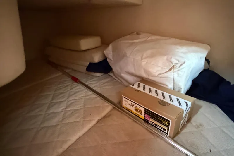 Slide: The Image of Interior storage area of a 2007 Sea Ray 280 Sundancer with cushions and a box. - 37