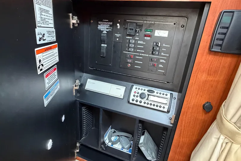 Slide: The Image of Electrical control panel inside 2007 Sea Ray 280 Sundancer boat cabin. - 38