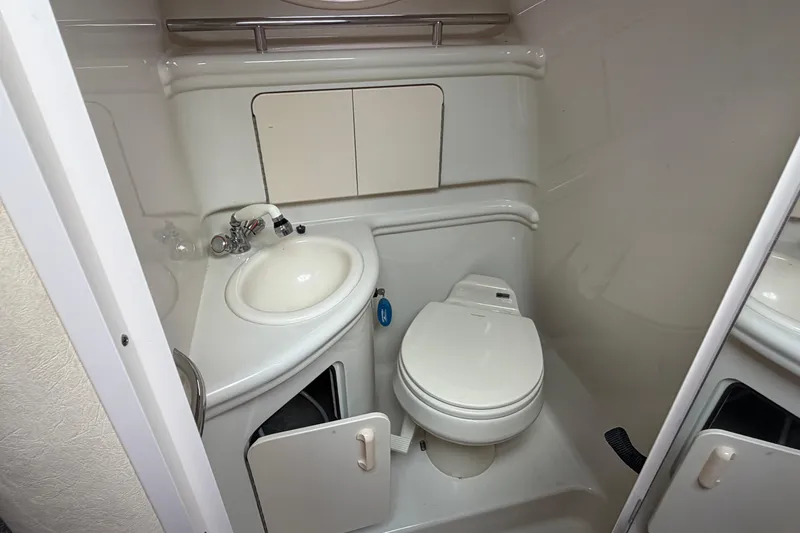 Slide: The Image of Compact bathroom in 2007 Sea Ray 280 Sundancer boat with sink and toilet. - 40