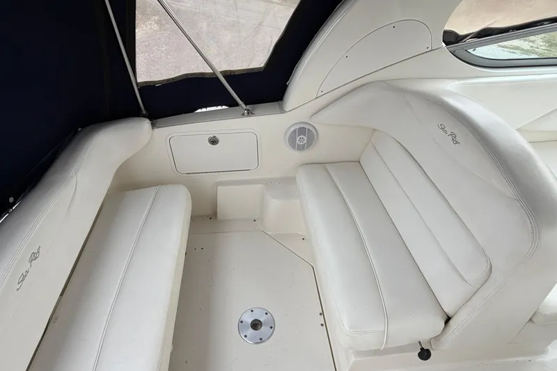 Slide: The Image of 2007 Sea Ray 280 Sundancer interior with white seating and speaker. - 43