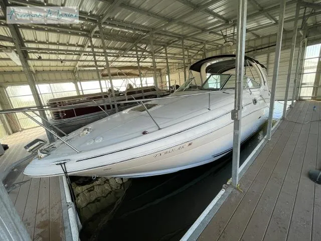 Slide: The Image of 2007 Sea Ray 280 Sundancer docked in a covered marina. - 5