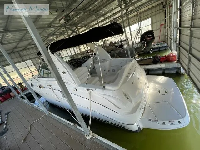 Slide: The Image of 2007 Sea Ray 280 Sundancer docked in covered marina, rear view. - 6