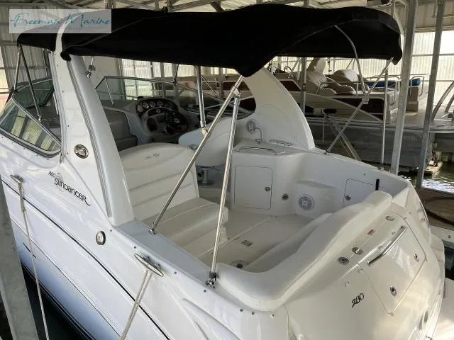 Slide: The Image of 2007 Sea Ray 280 Sundancer boat with black canopy in marina. - 8