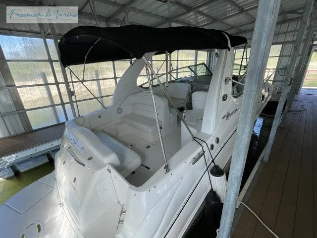Slide: The Image of 2007 Sea Ray 280 Sundancer boat docked in covered marina. - 9