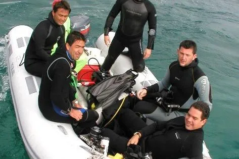 Slide: The Image of Group of divers on a Caribe C-12 inflatable boat, 2024 model, in open water. - 8