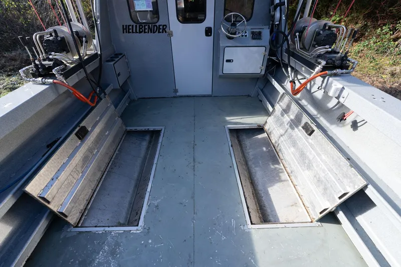 Slide: The Image of Interior of 2021 KingFisher 2825 Coastal Express boat with storage compartments and equipment. - 12