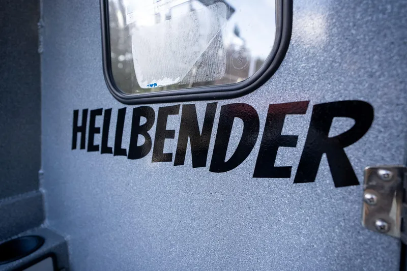 Slide: The Image of 2021 KingFisher 2825 Coastal Express boat with "HELLBENDER" name on metallic surface. - 17