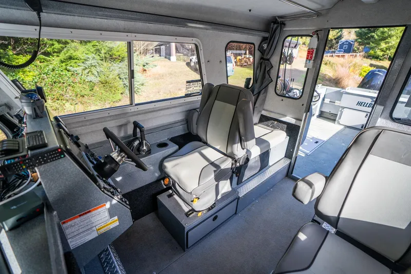 Slide: The Image of Interior of 2021 KingFisher 2825 Coastal Express boat, featuring modern seating and controls. - 20