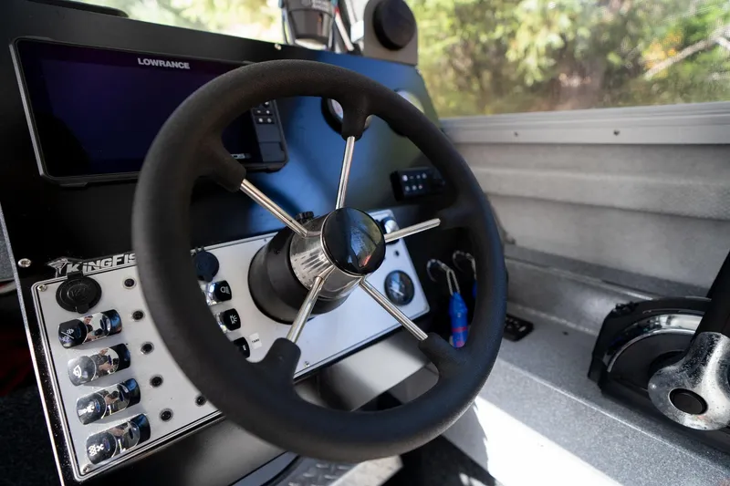 Slide: The Image of Steering wheel and controls of 2021 KingFisher 2825 Coastal Express boat. - 23