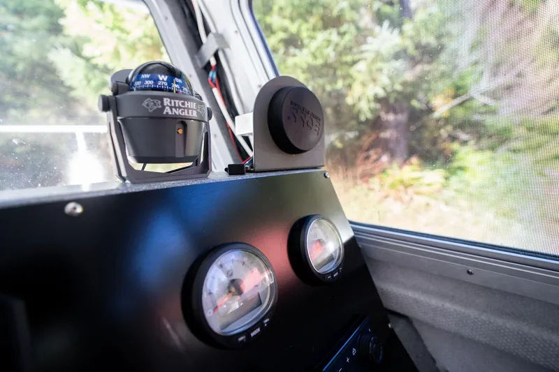 Slide: The Image of Dashboard of 2021 KingFisher 2825 Coastal Express with compass and gauges. - 24