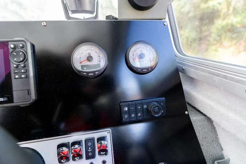 Slide: The Image of Dashboard of 2021 KingFisher 2825 Coastal Express with gauges and controls. - 25