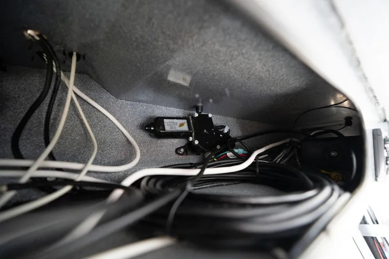 Slide: The Image of Interior wiring of 2021 KingFisher 2825 Coastal Express boat, showcasing electrical components. - 32