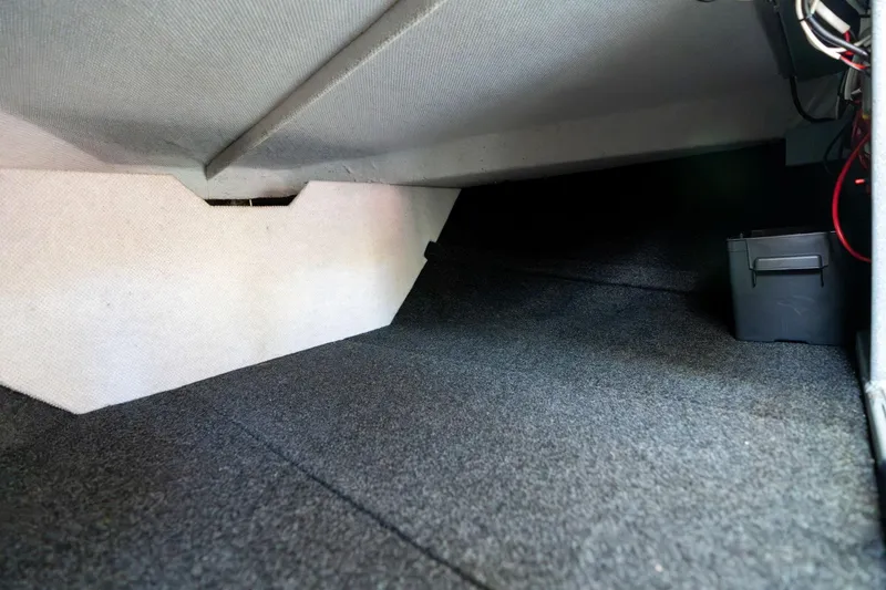 Slide: The Image of Interior storage space of 2021 KingFisher 2825 Coastal Express boat, featuring carpeted flooring. - 34